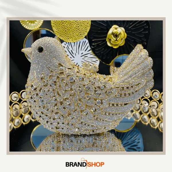 Sparkling gold bird-shaped bridal clutch bag with crystal embellishments